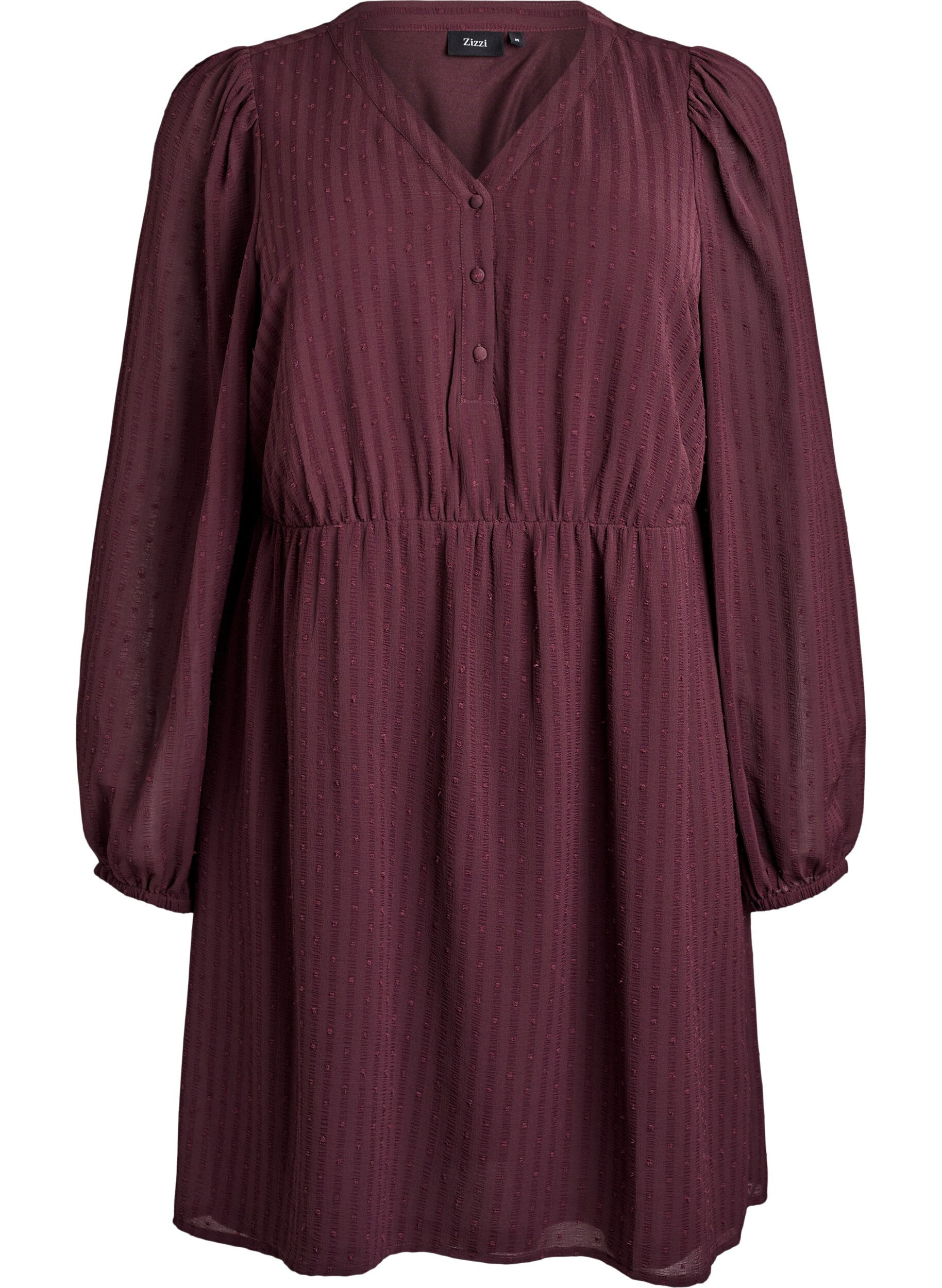 Kr&oacute;tka sukienka z tonalnymi paskami i wypuklymi kropkami