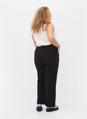 Rozszerzane spodnie z kieszeniami, Black, Model image number 1
