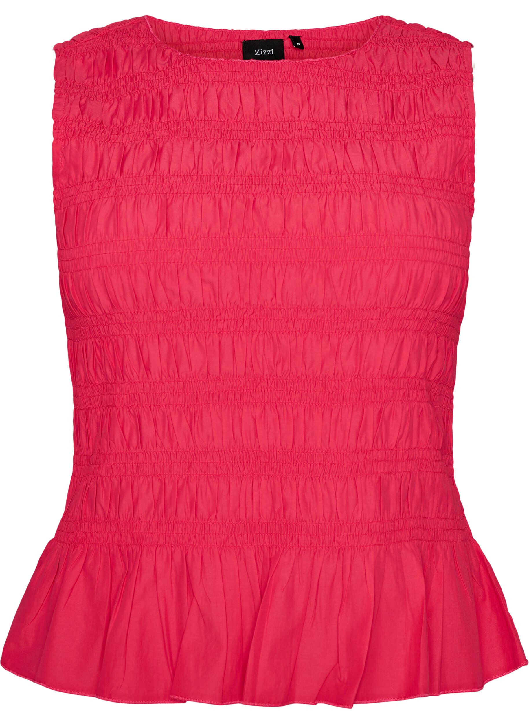 Bluzka z kolnierzykiem w ksztalcie l&oacute;dki i peplumowym wycieciem na dole