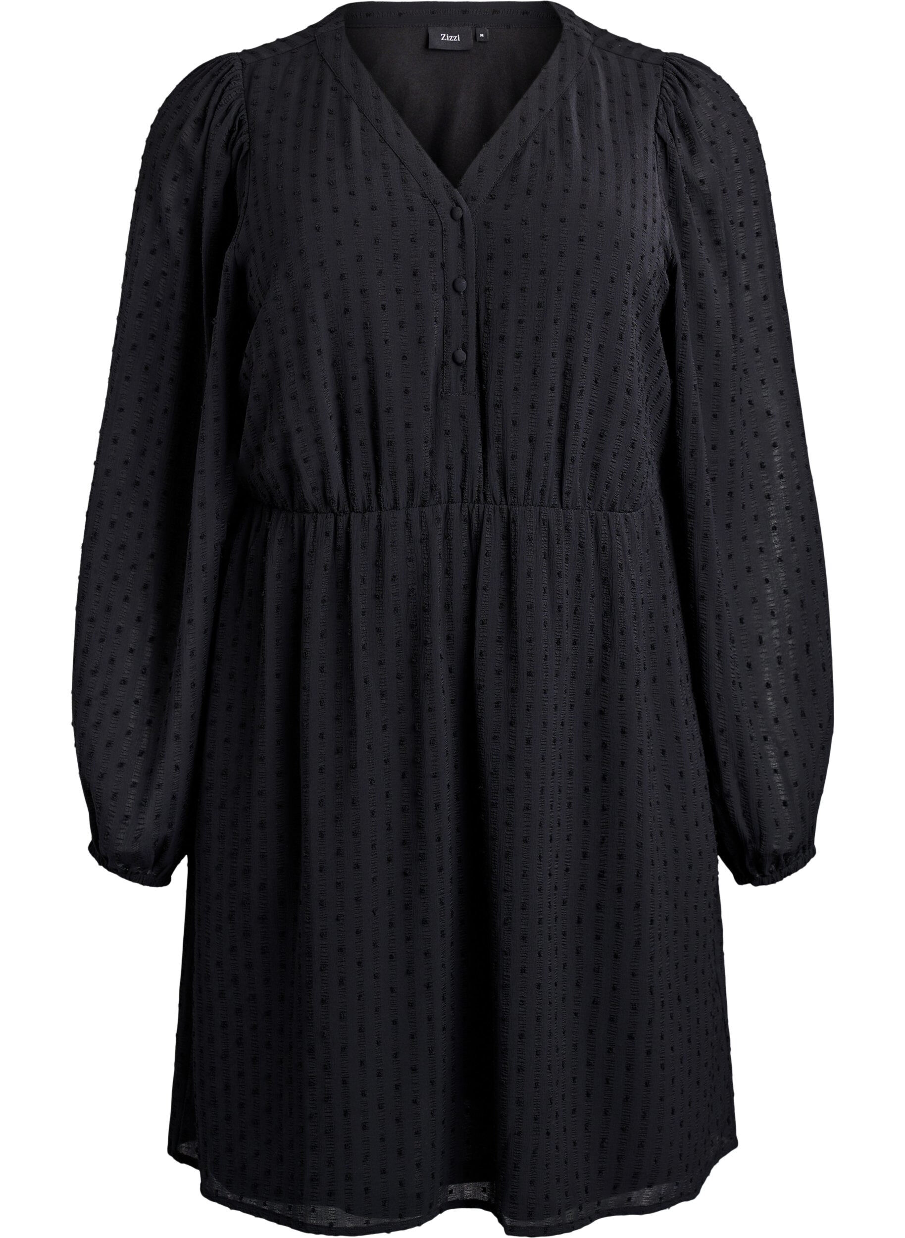 Kr&oacute;tka sukienka z tonalnymi paskami i wypuklymi kropkami