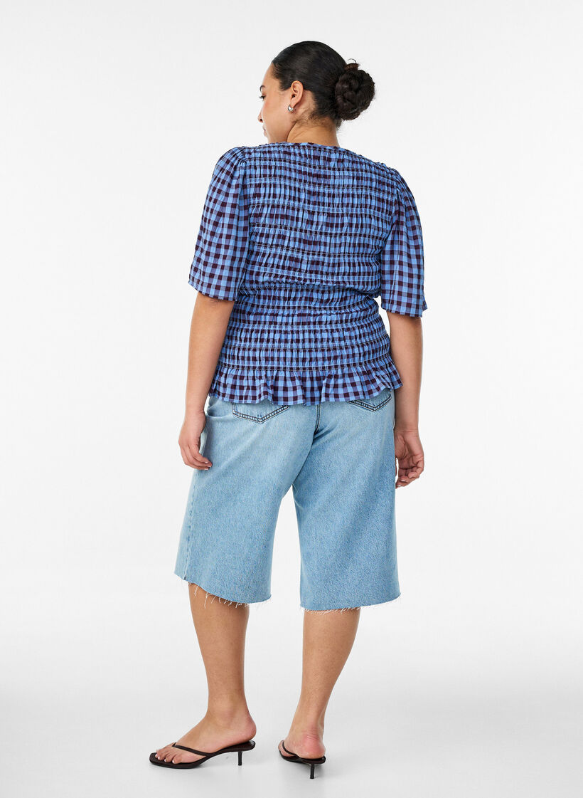 Uciete jeansy z efektem przetarcia i surowymi krawedziami, Niebieskie, Model image number 1