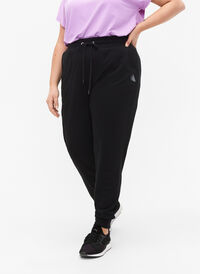 Luzne spodnie treningowe z kieszeniami, Black, Model