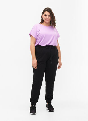 Luzne spodnie treningowe z kieszeniami, Black, Model image number 3