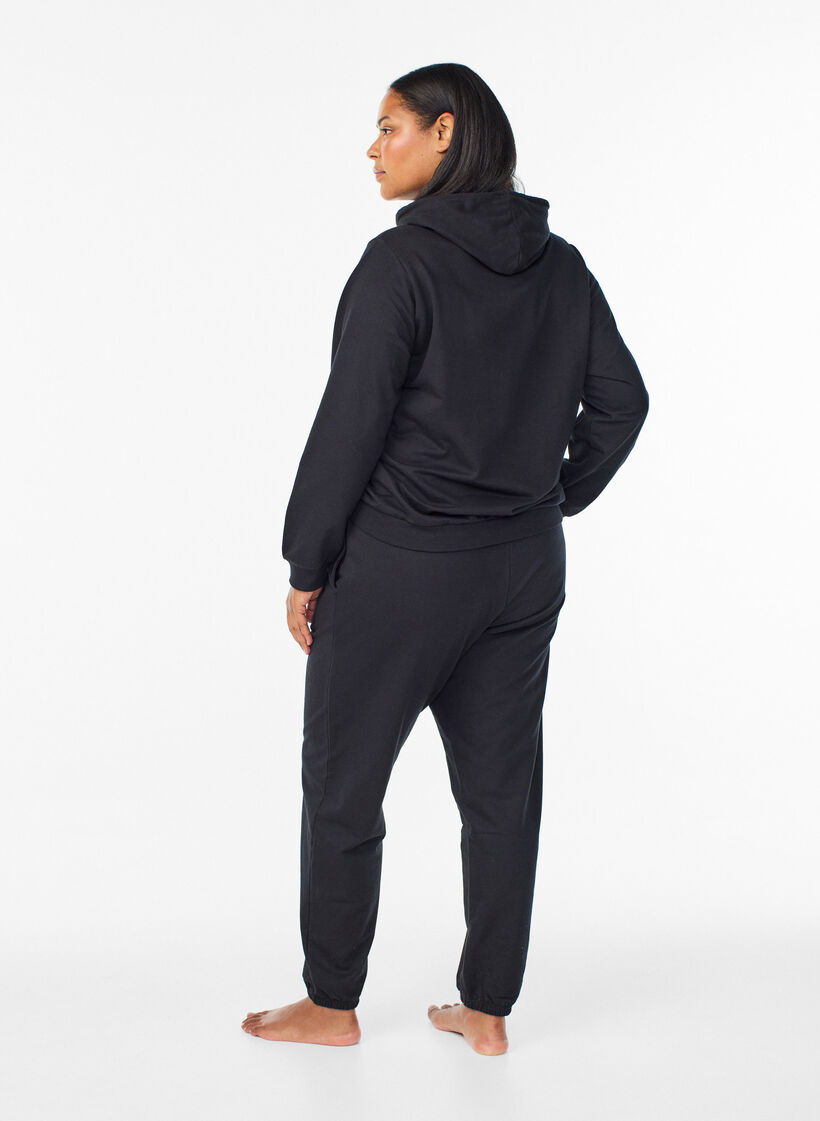 Spodnie dresowe z kieszeniami, Czarne, Model image number 1