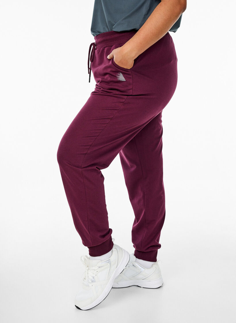 Luzne spodnie dresowe z kieszeniami, Czerwony, Model image number 0