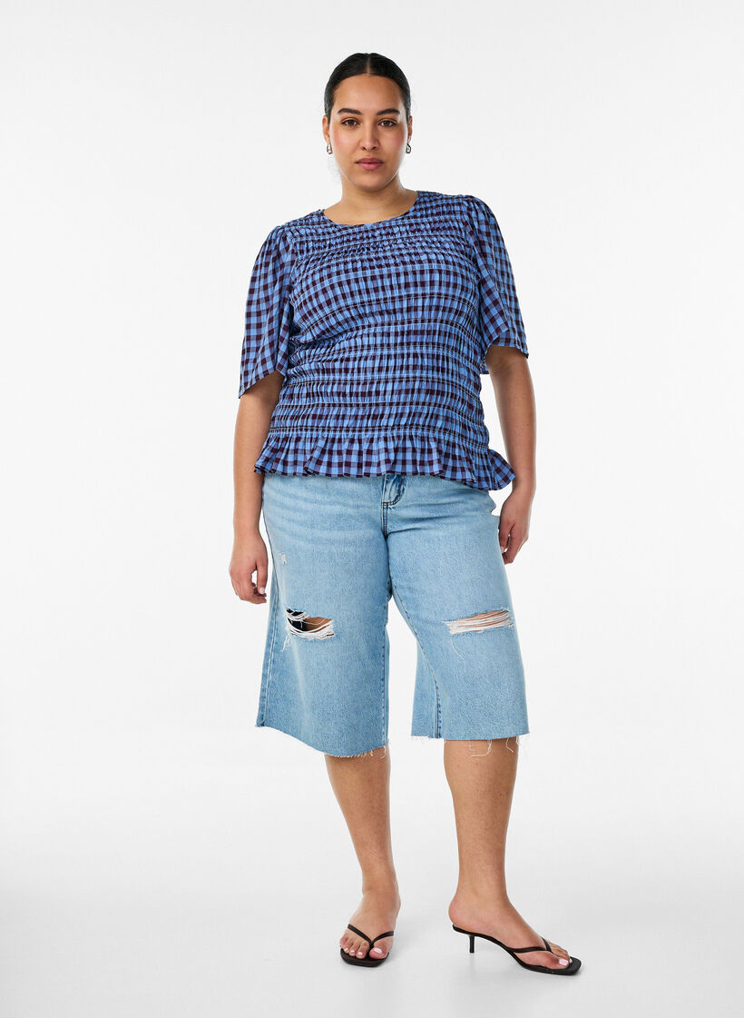 Uciete jeansy z efektem przetarcia i surowymi krawedziami, Niebieskie, Model