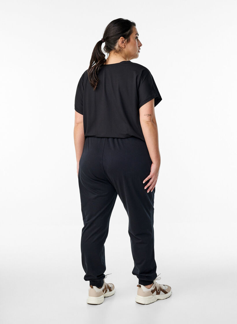 Luzne spodnie treningowe z kieszeniami, Czarne, Model image number 2